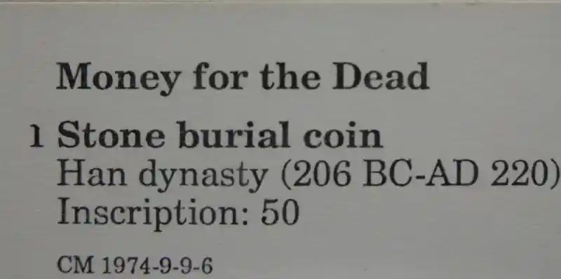 Money for the dead, coined-shaped charms